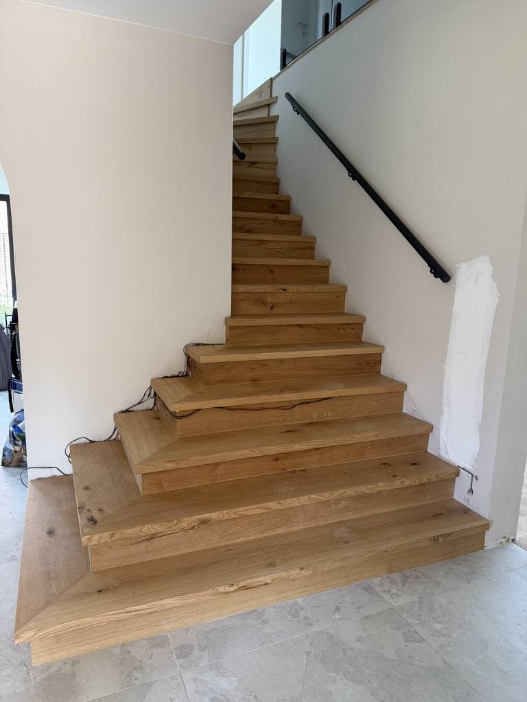 Modern staircase clad in oak